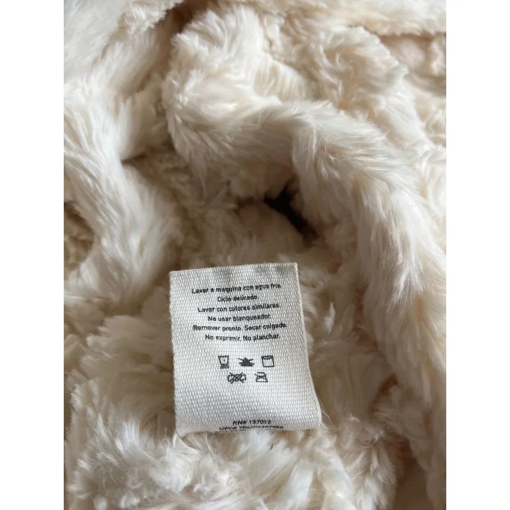 Peace & Pearls woman’s cream infinity scarf